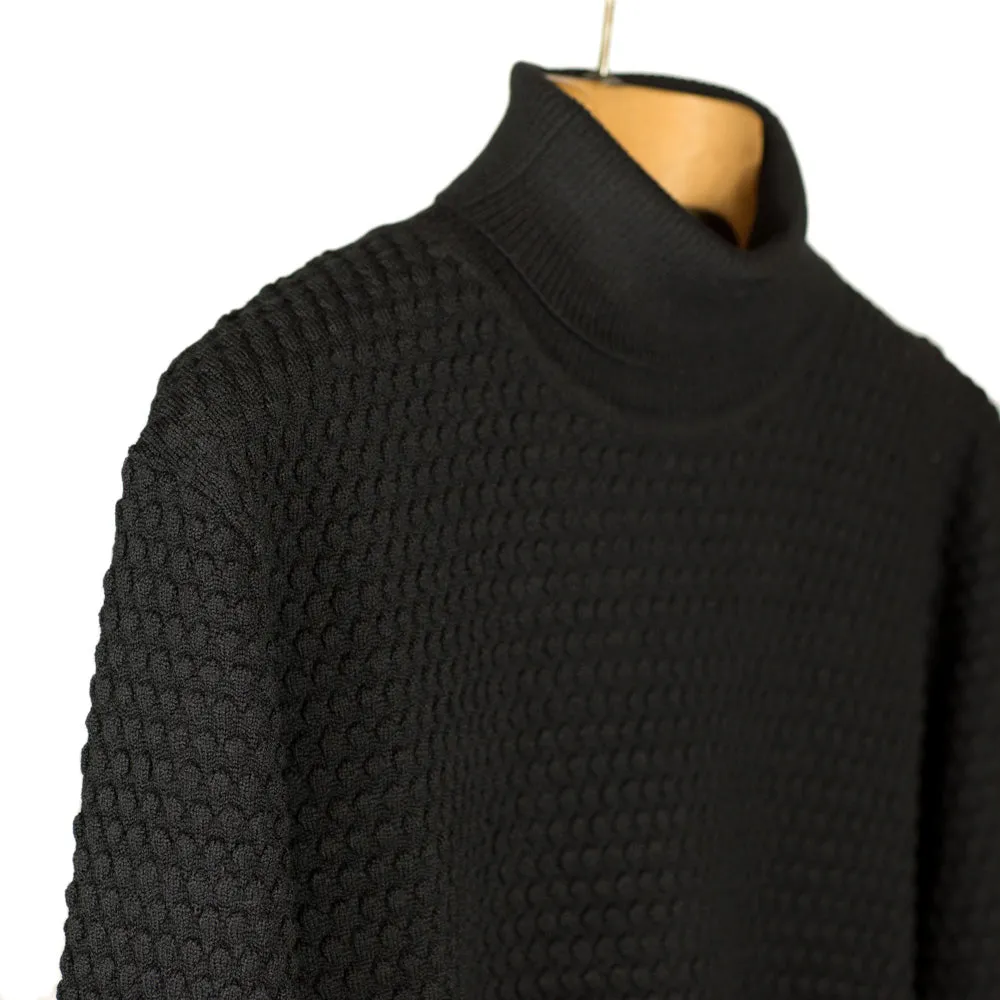 Black rollneck bubble stitch merino wool sweater