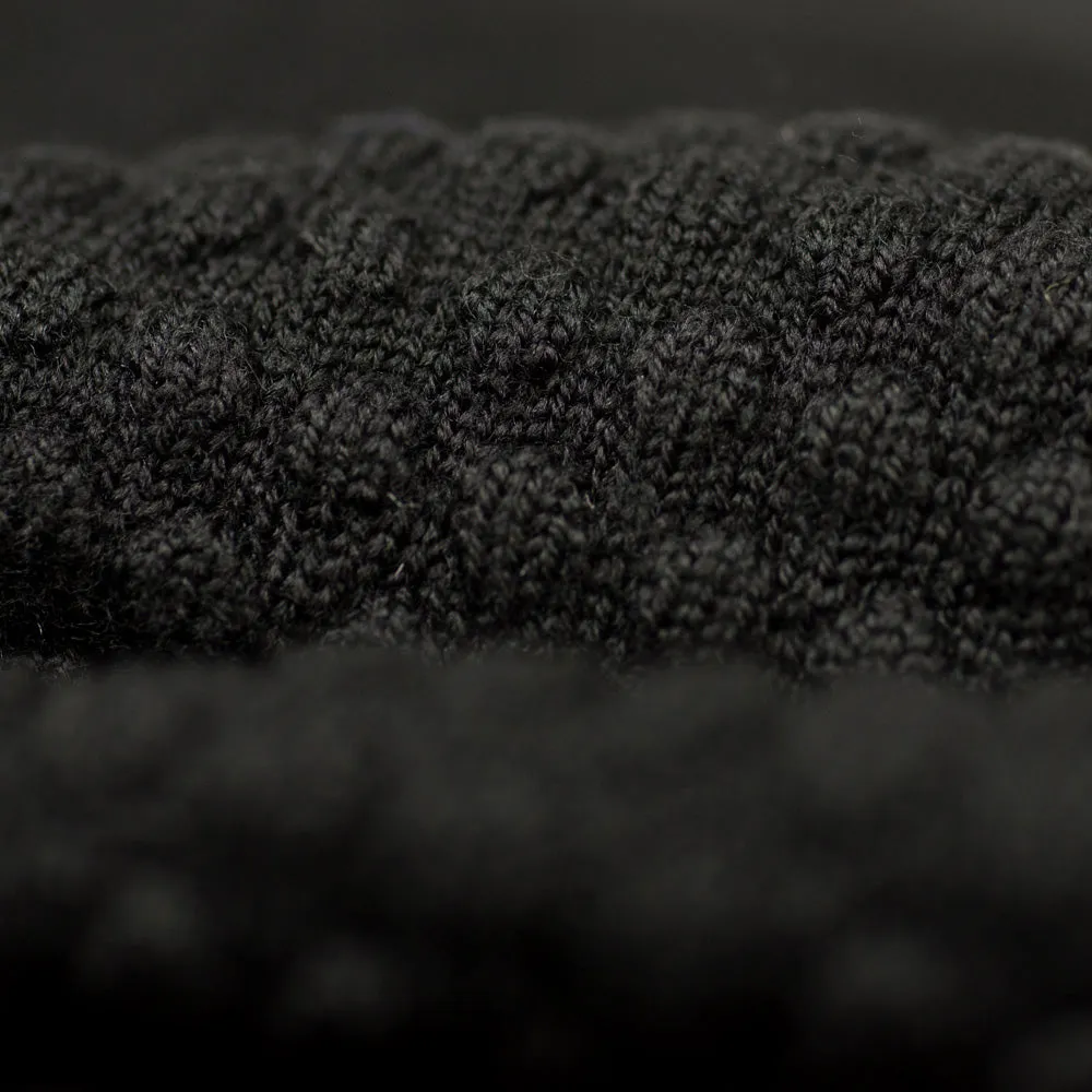 Black rollneck bubble stitch merino wool sweater